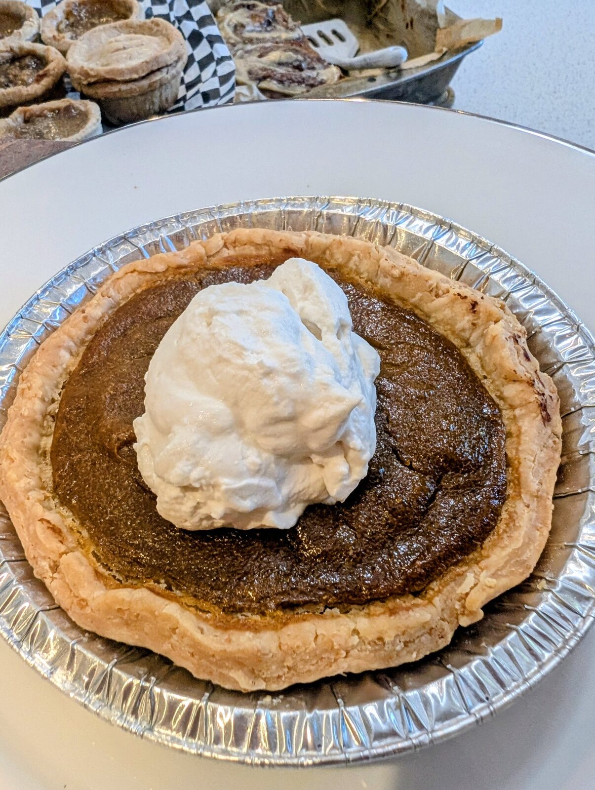 Butter tart with a dollop of fresh whipped cream